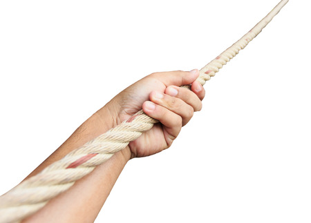Hand holding rope at the hillの写真素材