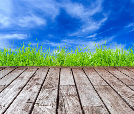 Old wood decking with blue skyの写真素材