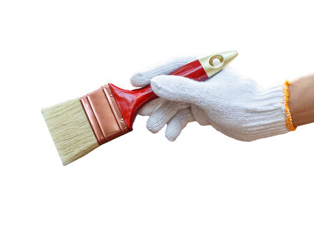 hand holding brush and paint timberの写真素材