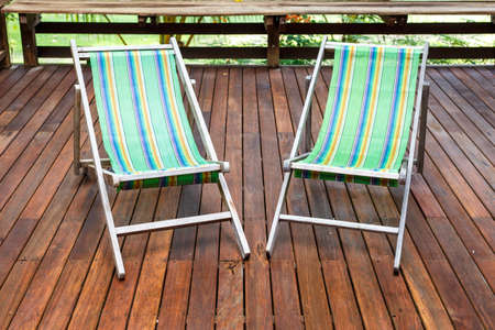 sun loungers stand on the terraceの写真素材