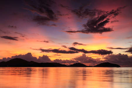 Sunrise with silhouette of mountain in Phuket, Thailandの写真素材