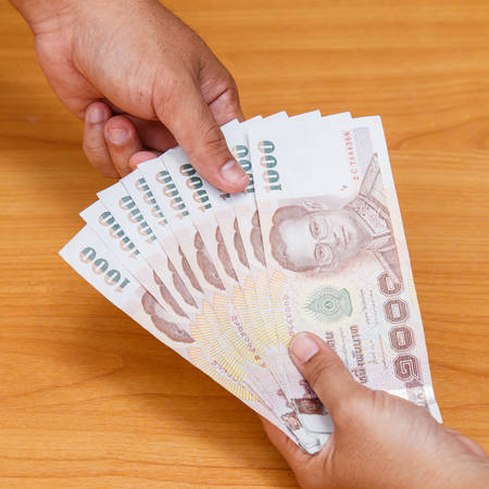 Hand holding money