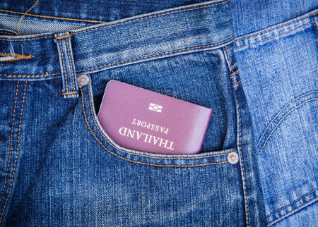 Close up of Passport in denim jeans pocketの写真素材