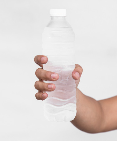 Close up of Woman hand holding bottle of drinking waterの写真素材