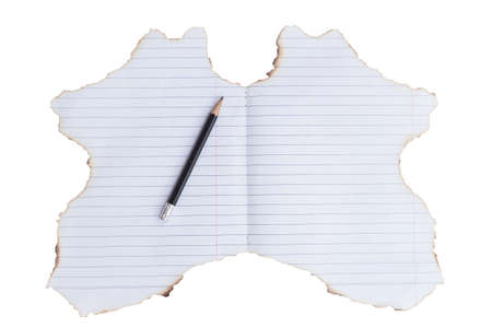 Lined paper with burned edgesの写真素材