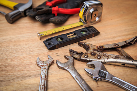 Closeup of assorted work tools on woodの写真素材