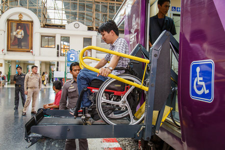 Close-up of male hand on wheel of wheelchairのeditorial素材