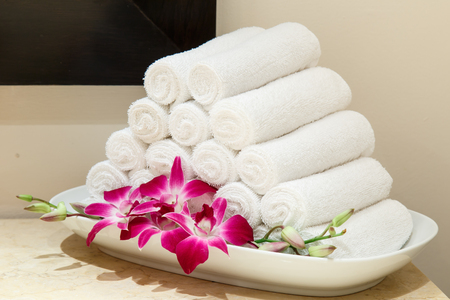 Roll of white towel on counterの写真素材