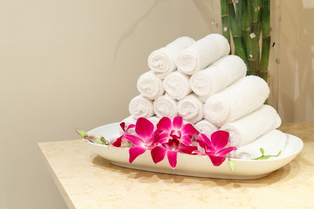 Roll of white towel on counterの写真素材