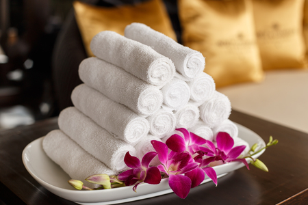 Roll of white towel on counterの写真素材