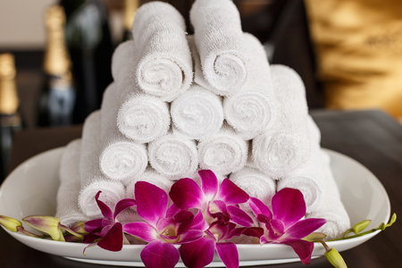 Roll of white towel on counterの写真素材