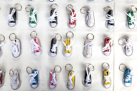 The tiny shoes use as Keychain for sale in market