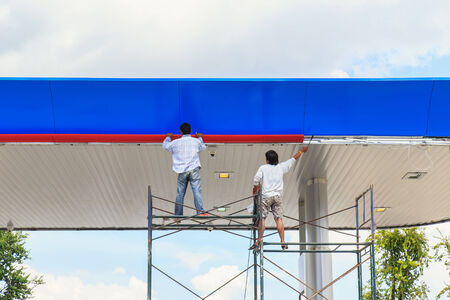 Two man working on scaffoldingのeditorial素材