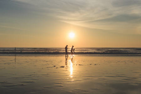 Silhouette of tourist at sunset beach in Phuket Thailandの写真素材