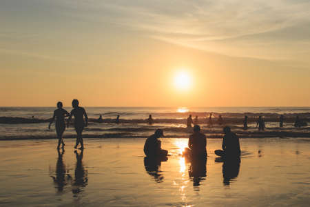 Silhouette of tourist at sunset beach in Phuket Thailandの写真素材