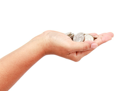 Woman hand holding coin isolates on white backgroundの写真素材