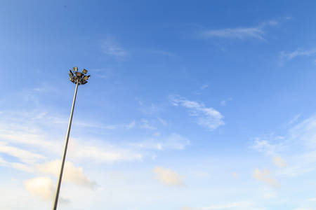 Spot light pole with blue sky in the stadiumの写真素材