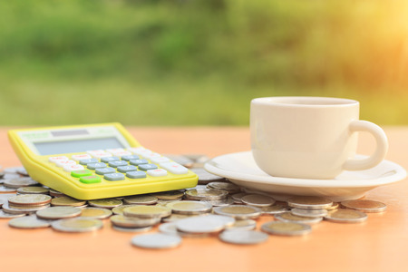 Close up calculator and coin on the tableの写真素材