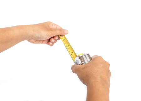 Hand holding measurement tape isolated on white background