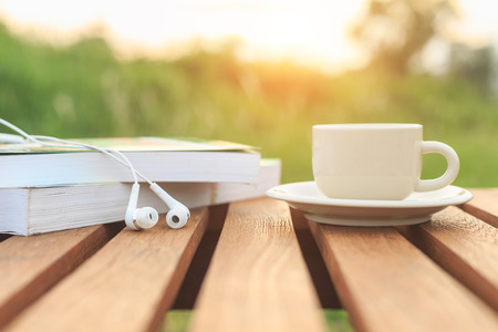 Coffee cup and book on the table in the morningの写真素材