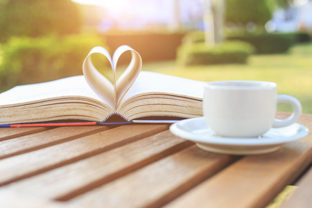 Coffee cup and book on the table in the morningの写真素材