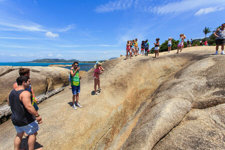 SURATTHANI - JULY 17 : Tourists at Grandfather and grandmother rock the famous place at Lamai Beach on 17 July, 2014 in Suratthani, Thailand.のeditorial素材