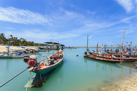 Traditional Thai boat or long tail boat stand at the beach