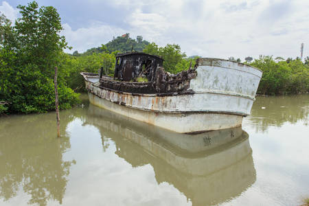 Old boat stand on small riverの写真素材
