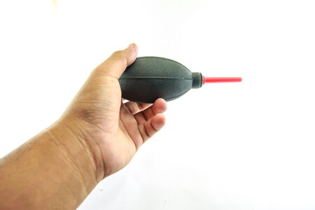 Hand holding Air Blowersの写真素材