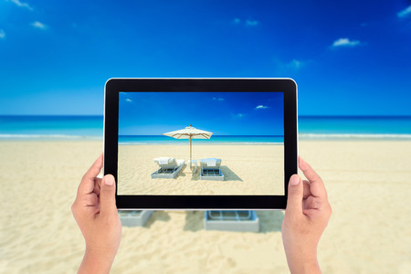 Hand holding tabletの写真素材