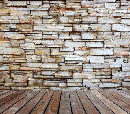 Old stone wall with wood deckingの写真素材