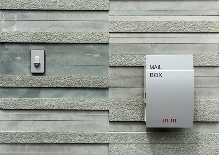 Mail box hang on the stone wallの写真素材