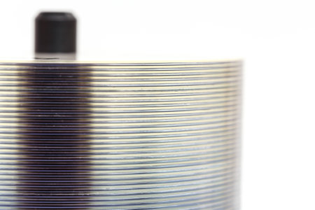 Close up stack of blank DVD isolated on white backgroundの写真素材