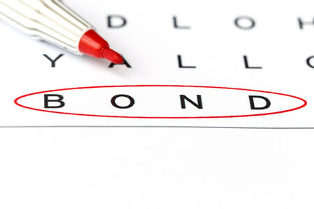 Bond in solving crossword puzzle, close upの写真素材