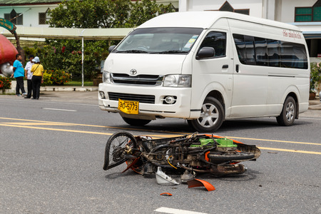 PHUKET, THAILAND - NOVEMBER 3 : Van accident on the road and crashed with motorcycle which causing the rider serious injury. November 3, 2014 in Phuket Thailand.のeditorial素材