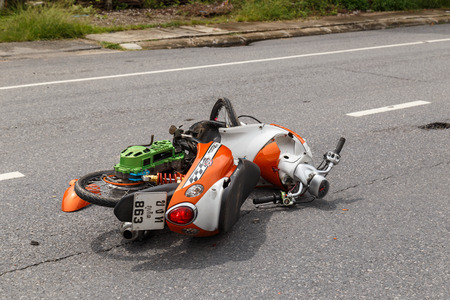 PHUKET, THAILAND - NOVEMBER 3 : Van accident on the road and crashed with motorcycle which causing the rider serious injury. November 3, 2014 in Phuket Thailand.のeditorial素材