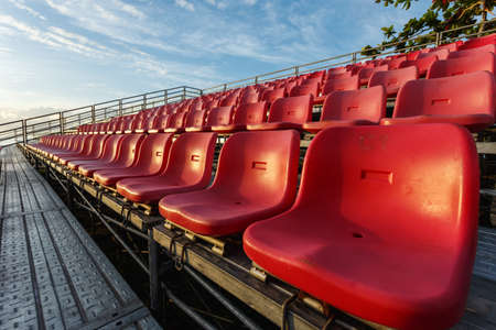 Empty plastic chairs at temporary grandstand stadium in Phuket, Thailand