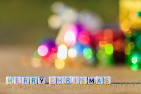 Merry Chrismas written in letter beads and Christmas decorationsの写真素材