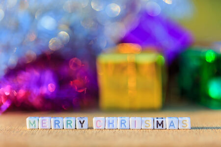 Merry Chrismas written in letter beads and Christmas decorationsの写真素材