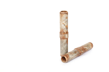The rusty metal for connect scaffolding isolated on white backgroundの写真素材