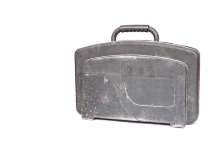 Old plastic black case with tools isolated on whiteの写真素材