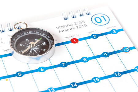 Close up Compass on calendarの写真素材