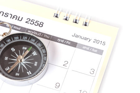 Close up Compass on calendarの写真素材