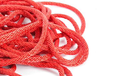 Red rope isolated on white backgroundの写真素材