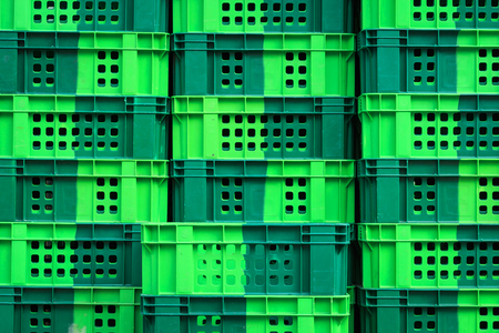 Stack of empty green crateの写真素材