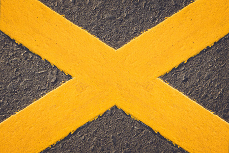 Asphalt road texture with yellow stripeの写真素材