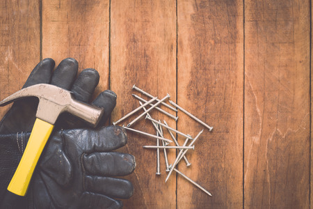 Close up of assorted work tools on wooden backgroundの写真素材