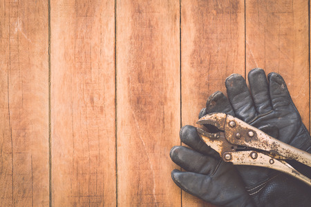 Close up of assorted work tools on wooden backgroundの写真素材