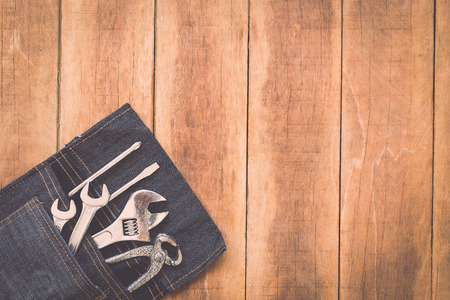 Close up of assorted work tools on wooden backgroundの写真素材