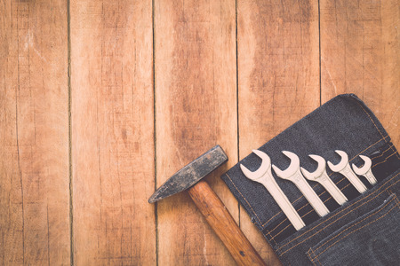 Close up of assorted work tools on wooden backgroundの写真素材